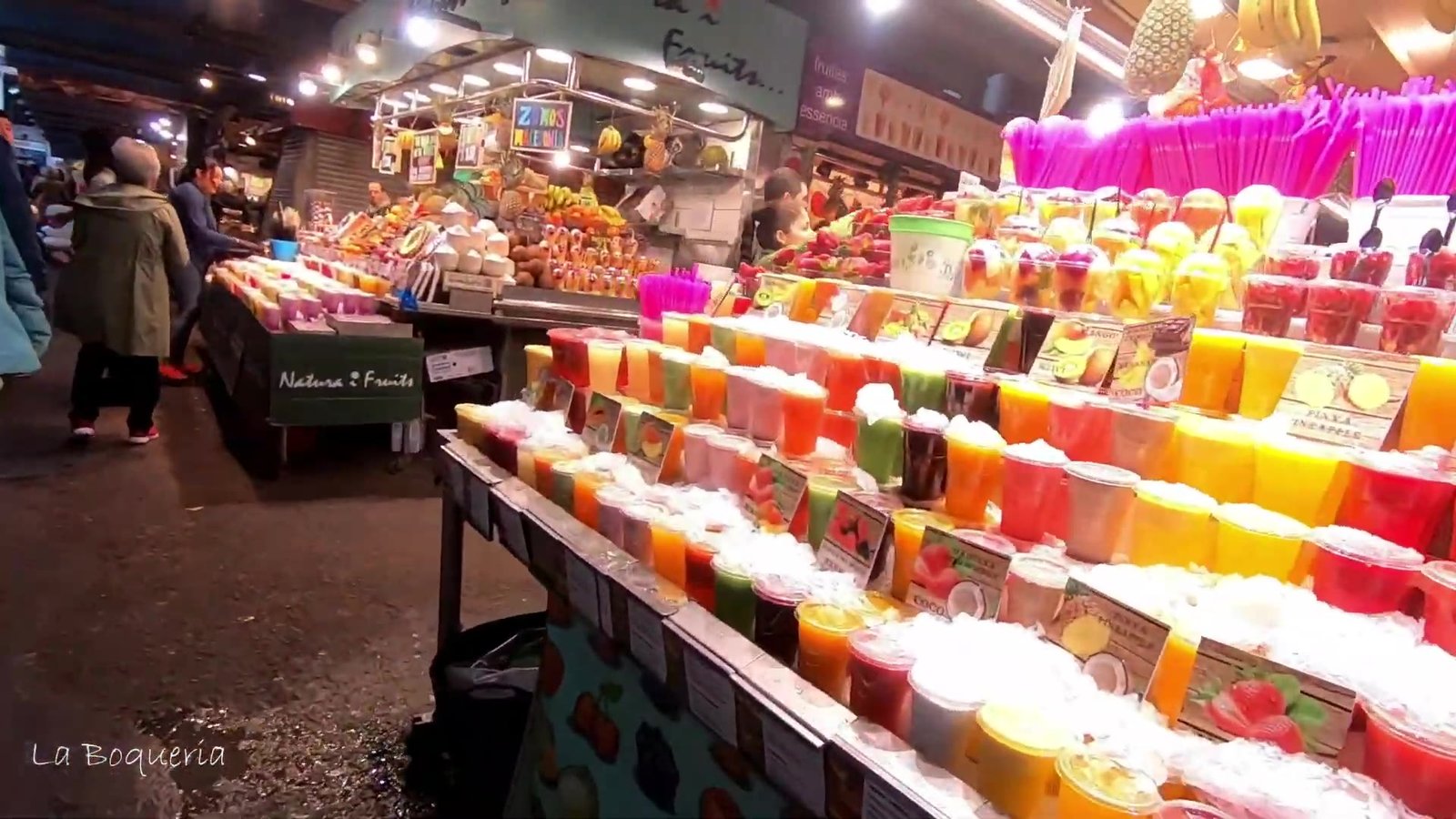 Colourful fruit juice stall at La Boqueria market in Barcelona