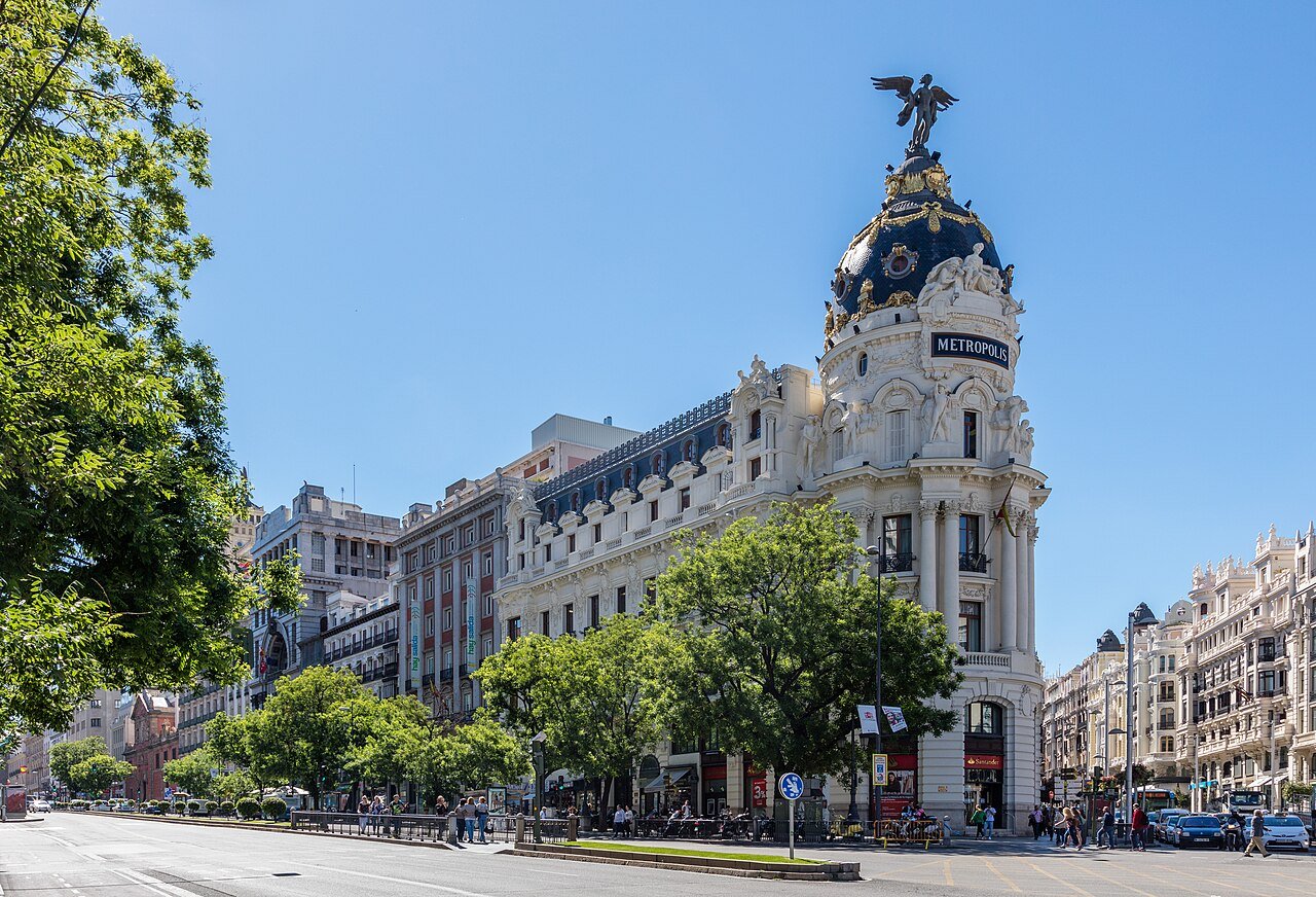 The domed Metrópolis Building in Madrid, topped by a winged statue, at the corner of Calle de Alcalá and the Gran Vía