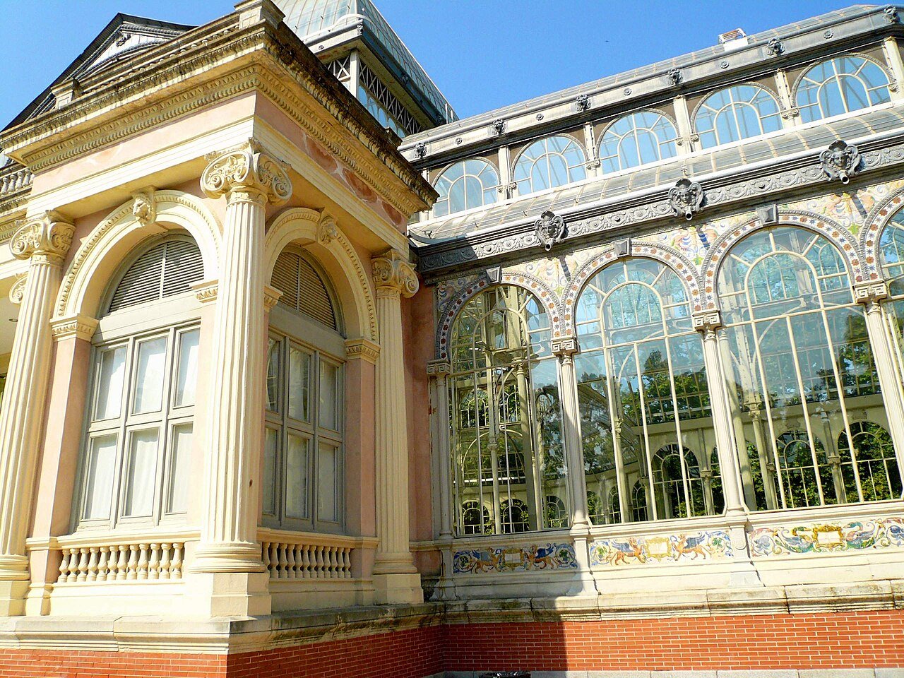The iron-and-glass Palacio de Cristal in Retiro Park, Madrid, with its glass dome and tiled stone base