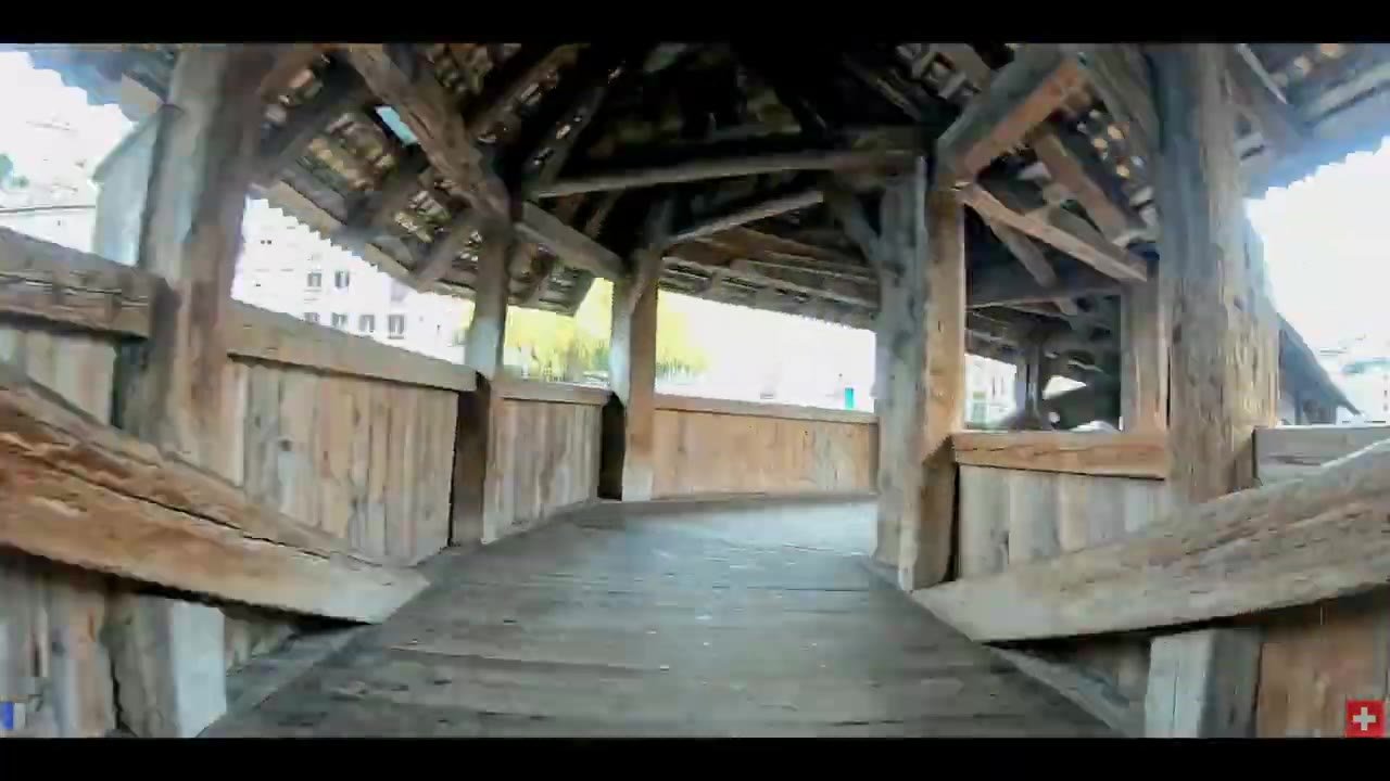 Walking inside the wooden Chapel Bridge in Lucerne